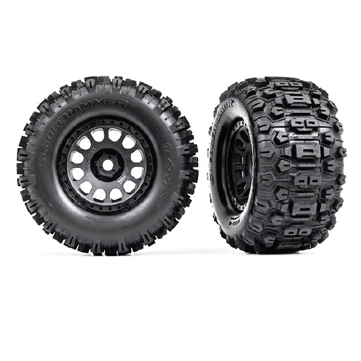 TraxxasTires & wheels, assembled, glued (XRT® Race black wheels, Sledgehammer® tires, foam inserts) (left & right)